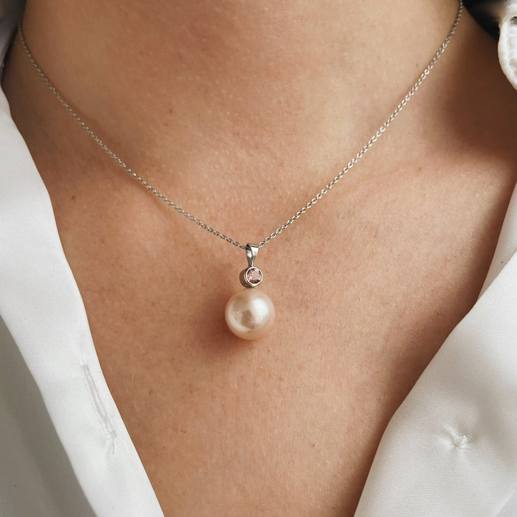 11mm South Sea pearl with bezel set diamond accent in 14k white gold.