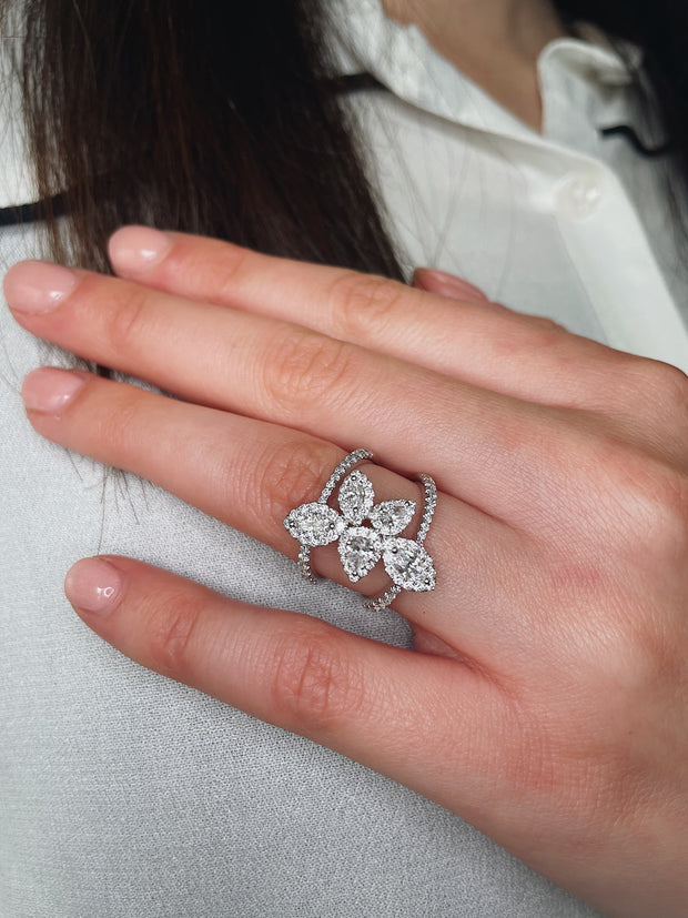 Shown here the diamond floral ring on hand.