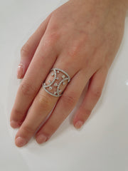 A statement cocktail ring that blends architectural beauty with refined sparkle.
