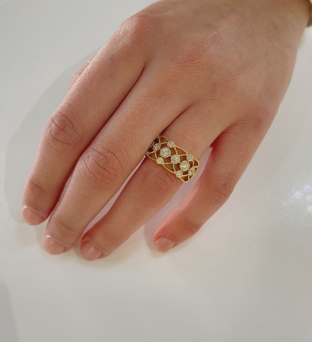 18K yellow gold band shown here elegantly on hand.