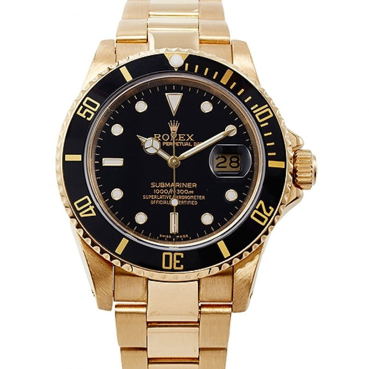 The black Cerachrom time-lapse bezel, with engraved gold numerals, pairs perfectly with the deep black lacquered dial.