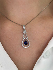 Delicate in design, this sapphire and diamond pendant is refined luxury.