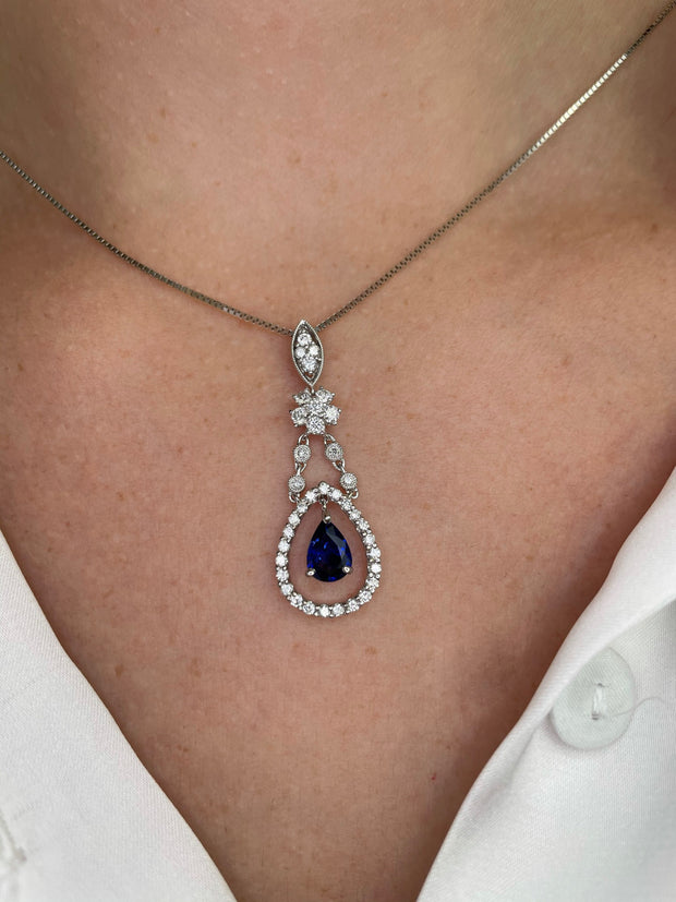 Delicate in design, this sapphire and diamond pendant is refined luxury.