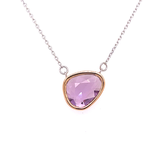 Organic beauty meets modern elegance in this pink sapphire slice necklace, a radiant celebration of individuality and color. 