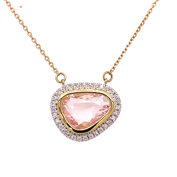 A detailed look at the fauceted pink sapphire and diamond pendant necklace.
