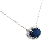 Side view of the sapphire diamond halo necklace.