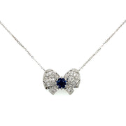 Stunning sapphire and diamond bow motif pendant necklace.