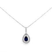 A detailed view of the vibrant sapphire at the center of a sparkling diamond halo.