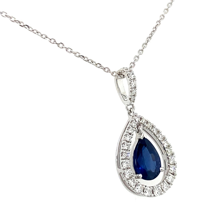 Sapphire pendant with natural diamond halo shown from an angle.