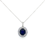 Oval sapphire center with inner diamond halo and outter sapphire halo.