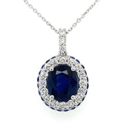 An 18K white gold necklace featuring a 2.23 CT oval sapphire center stone with  diamond accents.