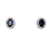 Closer detail of the oval sapphire and diamond halo stud earrings.