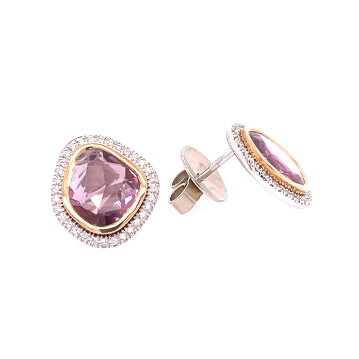 A closer detail of the pink sappire and diamond halo earrings in yellow and white gold.