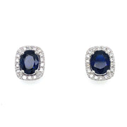 A detailed view of the sapphire and diamond stud earrrings