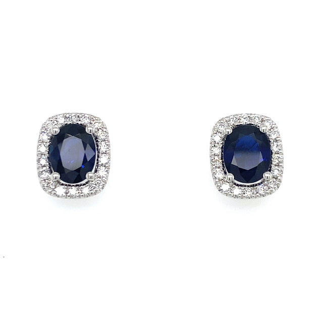 A detailed view of the sapphire and diamond stud earrrings