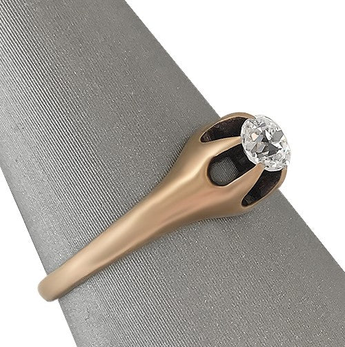 Side angle revealing the depth of the belcher setting and the satin texture of the 14K gold.