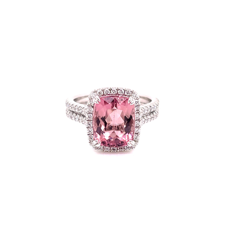 Pink tourmaline centerwith round brilliant cut diamonds set in 18K white gold.