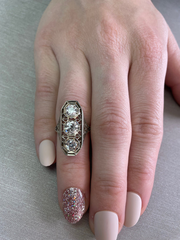 Worn on hand to show scale, brilliance, and the ring’s refined antique presence.


