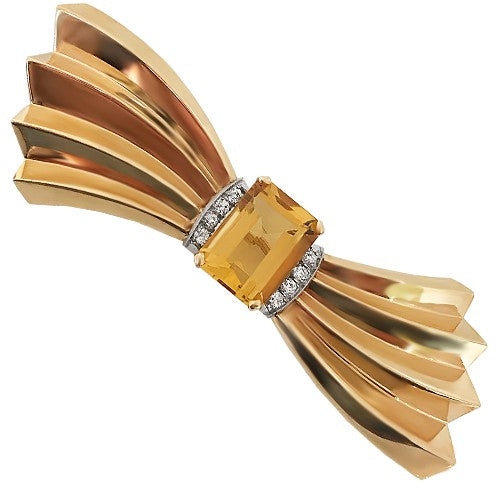 Vintage 14K Gold Bow Brooch with Citrine & Diamonds
A refined statement of classic elegance, featuring a radiant emerald cut citrine and diamond accents.

