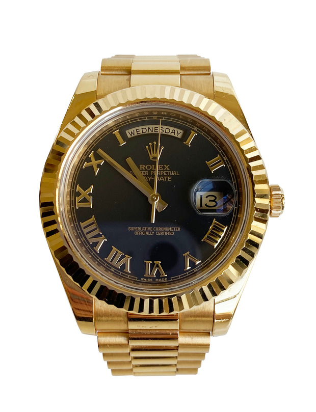 Rolex DayDate II Presidential close up detailing the roman numeral markers and cyclops date window.