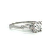 Side profile revealing the platinum setting and low-profile design.