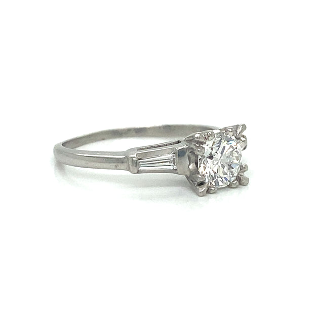 Side profile revealing the platinum setting and low-profile design.