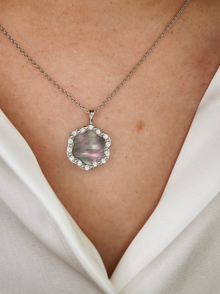 This piece sparkles gently with every movement, adding a refined brilliance to its moody elegance.