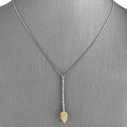 A graceful fusion of brilliance and color, this 18K white gold pendant necklace is both modern and timeless.