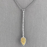 Suspended from a sleek 16-inch snake chain, this pendant is a refined statement piece.