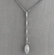 Drop-style silhouette for graceful movement and light-catching sparkle.