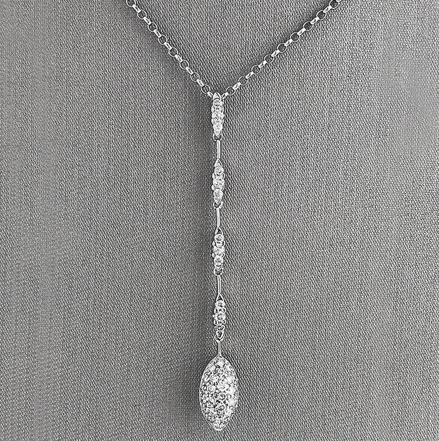 Drop-style silhouette for graceful movement and light-catching sparkle.