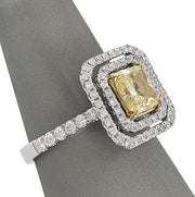 Fancy Yellow Radiant cut diamond ring with double halo
