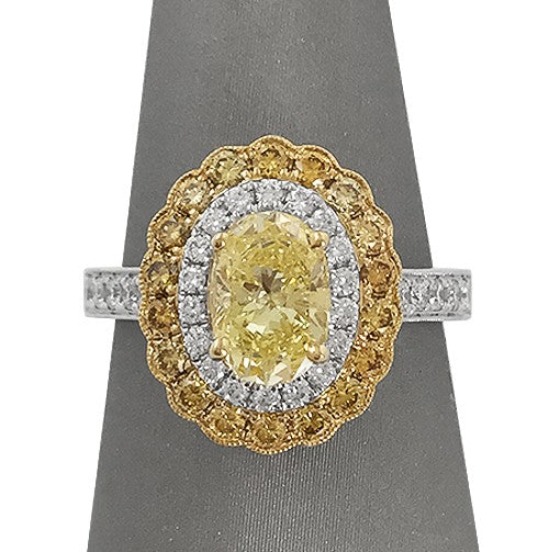 Fancy Yellow Oval Diamond Ring with double white and yellow diamond halo