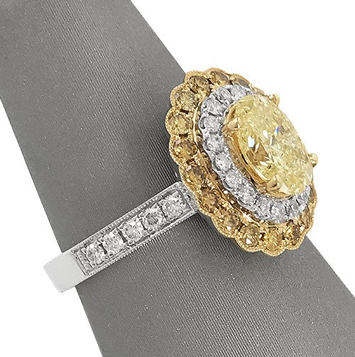 Fancy Yellow Oval Diamond Ring with double white and yellow diamond halo