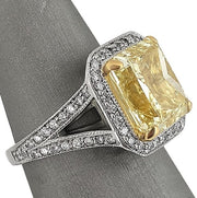 Radiant cut fancy yellow diamond ring
