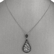 Crafted in 14K white gold with a bold zebra-inspired design.