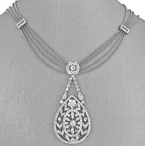 14K white gold triple strand necklace with diamond drop pendant.