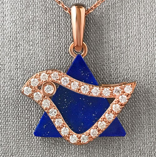 A rose gold dove pendant set with round brilliant cut diamonds, mounted on a lapis lazuli background.