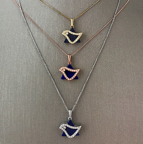 Shown here are three 18k gold options for the Dove charm.