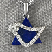 An 18 karat white gold dove pendant set with round brilliant cut diamonds, featuring a blue lapis lazuli background.