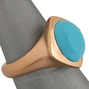 Side profile of rose gold ring with matte finish band and polished turquoise setting