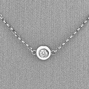 A closer detailed look at the bezel set diamond.
