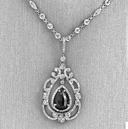Diamond drop pendant on diamond bezel chain.