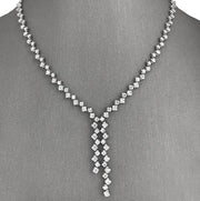 18k white gold fixed lariat diamond necklace with a series of round brilliant diamonds, totaling 4.40 ctw.