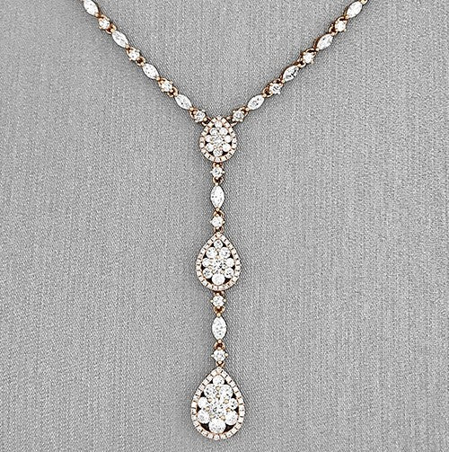 A close detail on the diamonds cascading down the y-designed necklace.