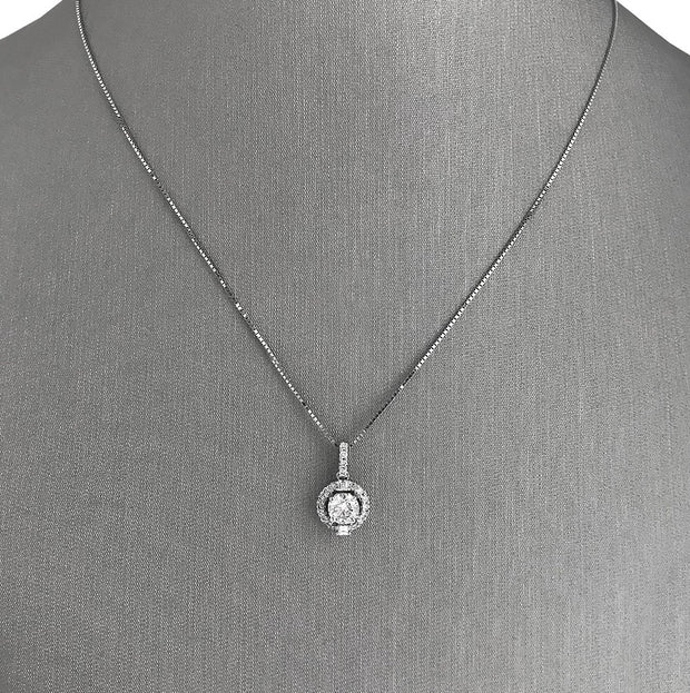 Stunning round brilliant diamond set in a halo of shimmering diamond accents.