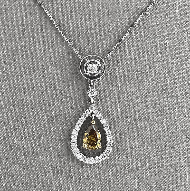 Green pear-shaped diamond with diamond halo drop pendant necklace.