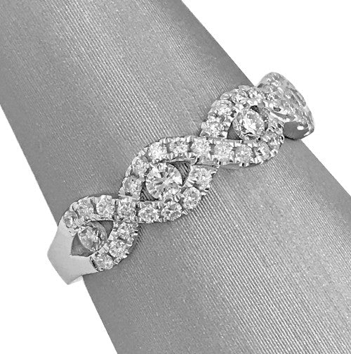 Larger diamonds accent each open end for added brilliance.