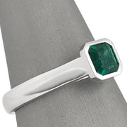 Emerald white gold bezel ring