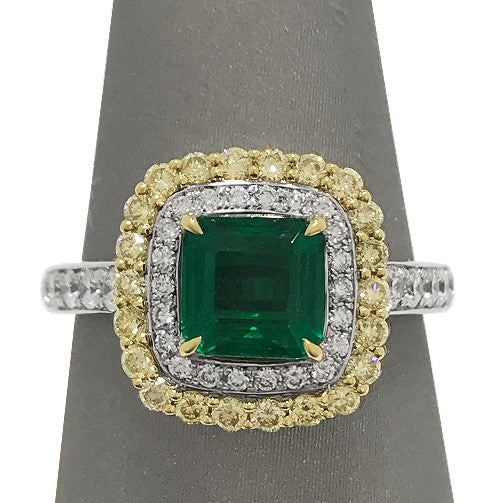 Crafted in 18K white and yellow gold for a dynamic two-tone finish with stunning Emerald at center.